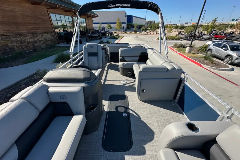 Slide: The Image of 2026 Sun Tracker SportFish 22 XP3 pontoon boat with spacious seating and modern design. - 16