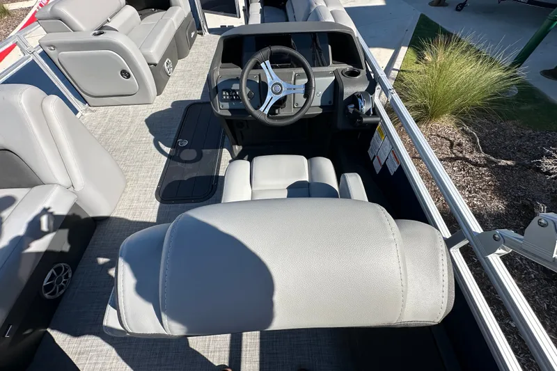 Slide: The Image of Interior of 2026 Sun Tracker SportFish 22 XP3 boat with steering wheel and seating. - 20