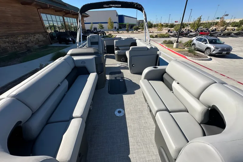 Slide: The Image of 2026 Sun Tracker SportFish 22 XP3 pontoon boat with spacious seating and modern design. - 15