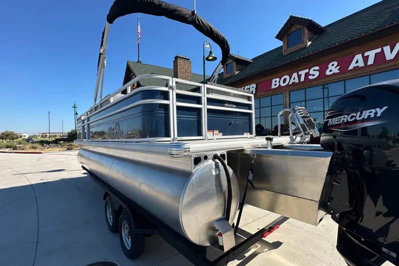 Slide: The Image of 2026 Sun Tracker SportFish 22 XP3 pontoon boat with Mercury engine at dealership. - 14
