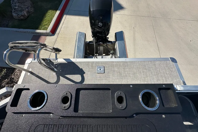 Slide: The Image of Sun Tracker SportFish 22 XP3 boat deck with motor and cup holders, 2026 model. - 24