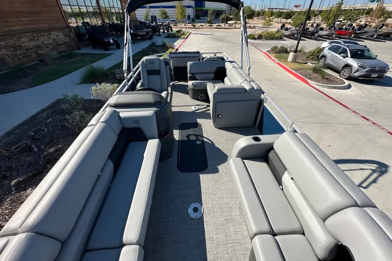 Slide: The Image of 2026 Sun Tracker SportFish 22 XP3 pontoon boat with spacious seating and modern design. - 28