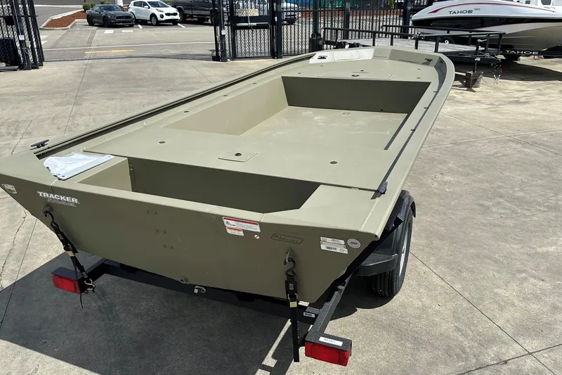 Slide: The Image of 2026 Tracker Grizzly 1754 Utility boat on trailer in outdoor lot. - 3