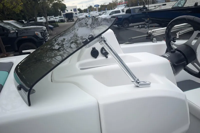 Slide: The Image of 2026 Tahoe T18 boat dashboard with steering wheel and windshield. - 15