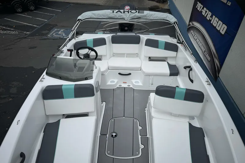 Slide: The Image of 2026 Tahoe T18 boat interior with modern seating and steering wheel. - 18