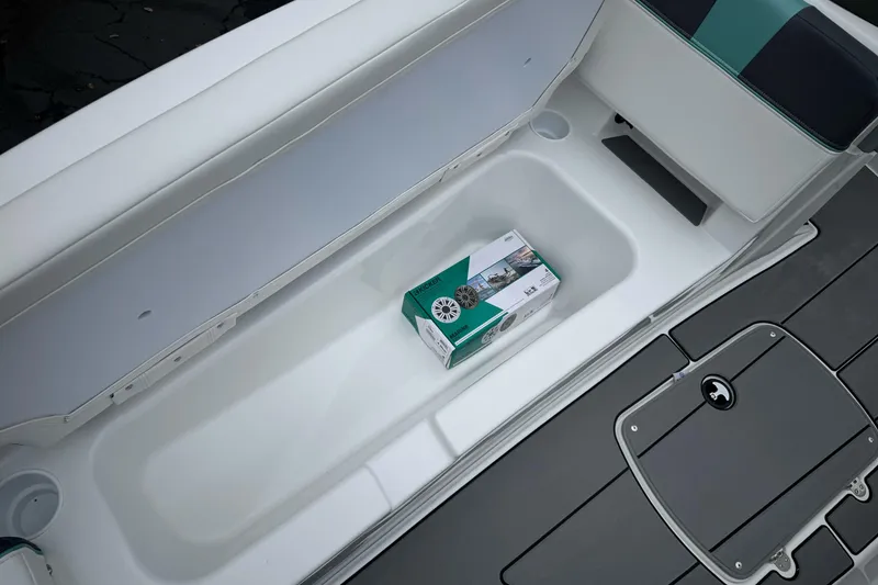 Slide: The Image of 2026 Tahoe T18 boat storage compartment with a packaged marine speaker inside. - 19
