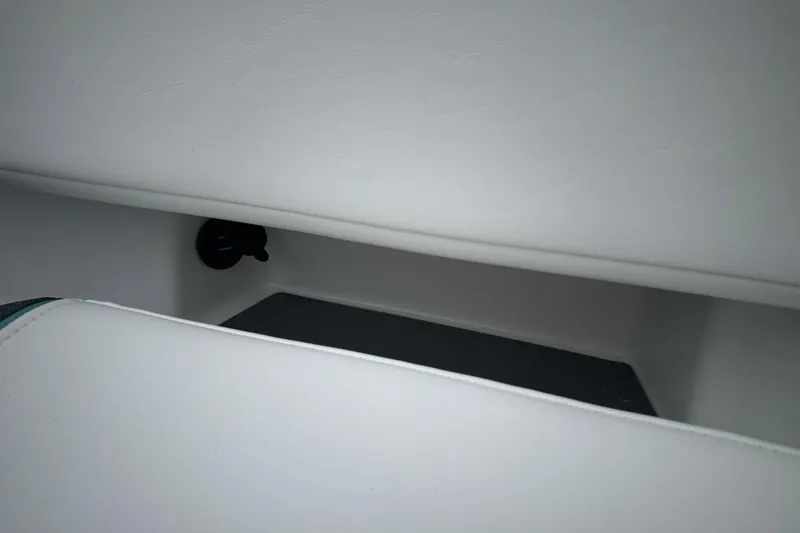 Slide: The Image of 2026 Tahoe T18 interior storage compartment with sleek white finish. - 20