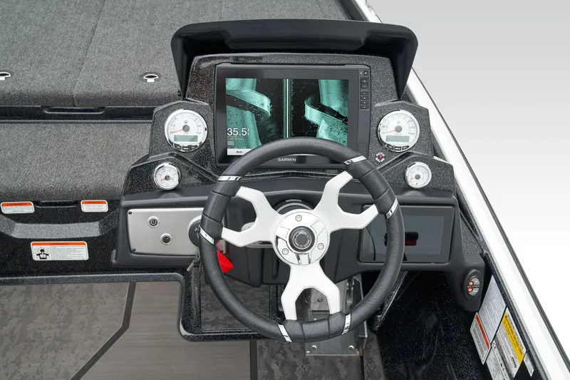 Slide: The Image of 2026 Nitro Z21 XL Pro boat storage compartment with open lid and cup holders. - 33