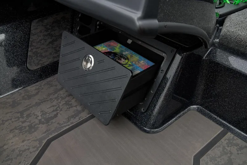 Slide: The Image of 2026 Nitro Z21 XL Pro boat interior with blue and gray seats on a concrete surface. - 44