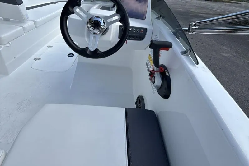 Slide: The Image of 2026 Tahoe T16 boat interior with steering wheel and control panel. - 2