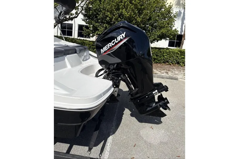 Slide: The Image of 2026 Tahoe T16 boat with Mercury outboard motor in a sunny outdoor setting. - 8