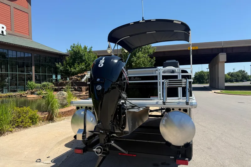 Slide: The Image of 2026 Sun Tracker Fishin' Barge 22 DLX pontoon boat with powerful outboard motor. - 13
