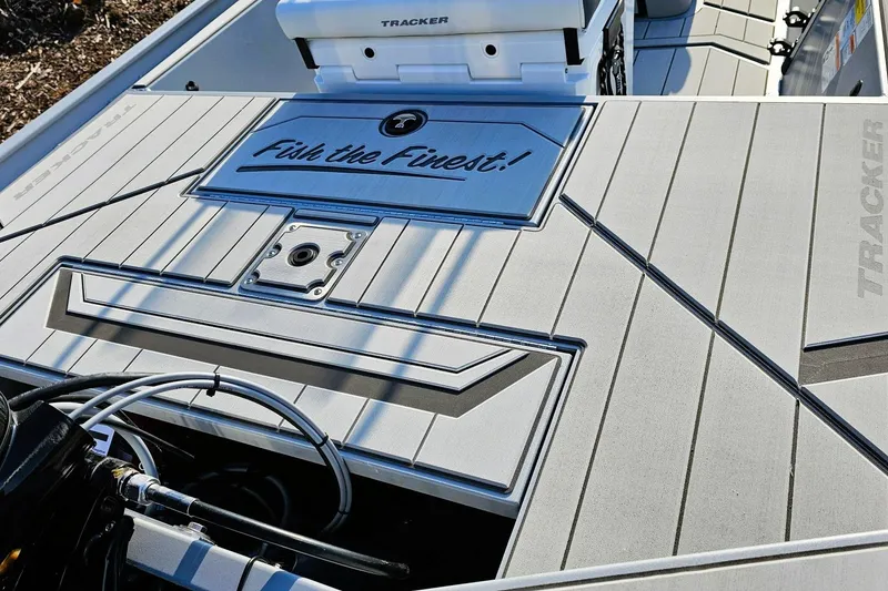Slide: The Image of 2026 Tracker Bass Tracker Classic CC boat deck with "Fish the Finest!" slogan. - 13