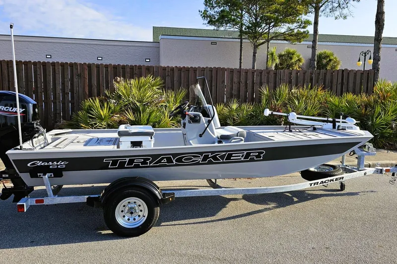 Slide: The Image of 2026 Tracker Bass Tracker Classic CC boat on trailer, parked outdoors. - 15