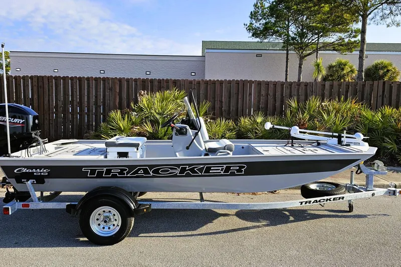 Slide: The Image of 2026 Tracker Bass Tracker Classic CC boat on trailer, parked outdoors. - 4