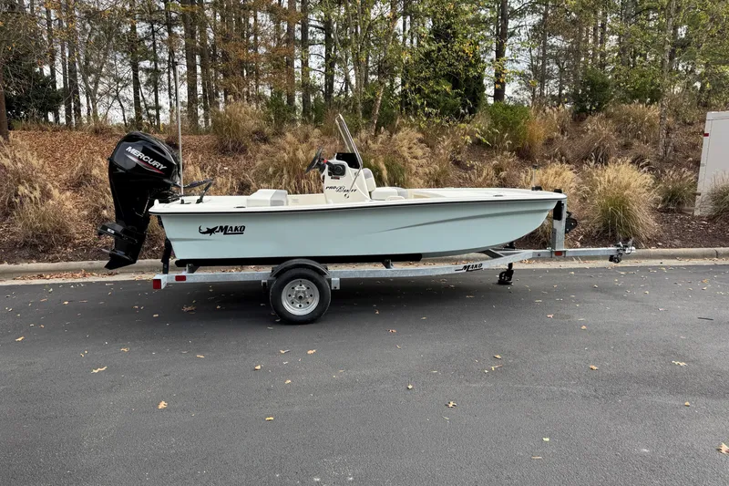 The Image of 2026 Mako Pro Skiff 13 CC boat on trailer, parked outdoors. - 0