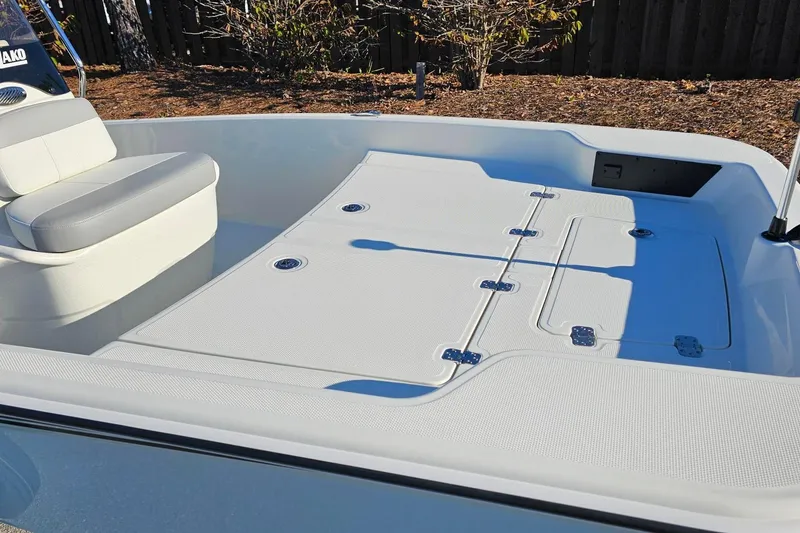 Slide: The Image of 2026 Mako Pro Skiff 15 CC boat interior with seating and storage compartments. - 7
