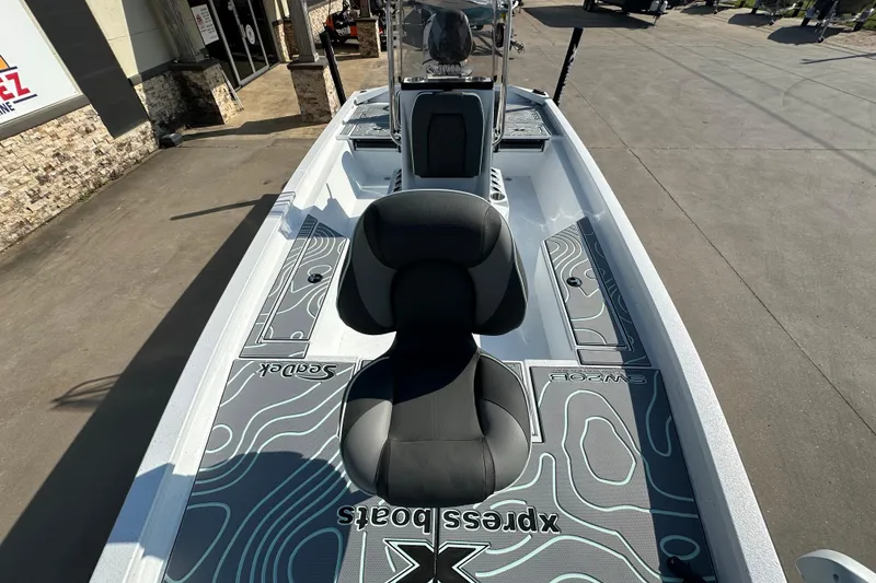 Slide: The Image of 2026 Xpress SW20B boat interior with sleek seating and modern design. - 11