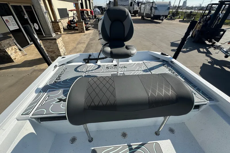 Slide: The Image of 2026 Xpress SW20B boat interior with seating and storage compartments. - 16