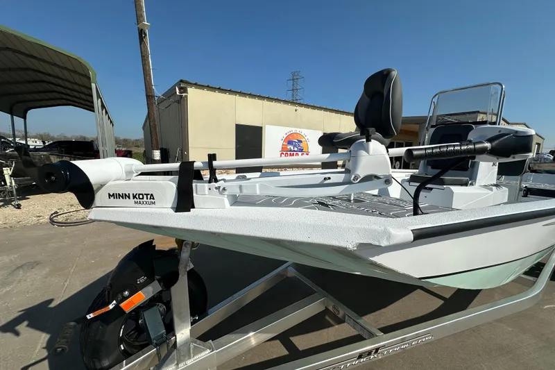 Slide: The Image of 2026 Xpress SW20B boat with Minn Kota Maxxum trolling motor on trailer. - 20