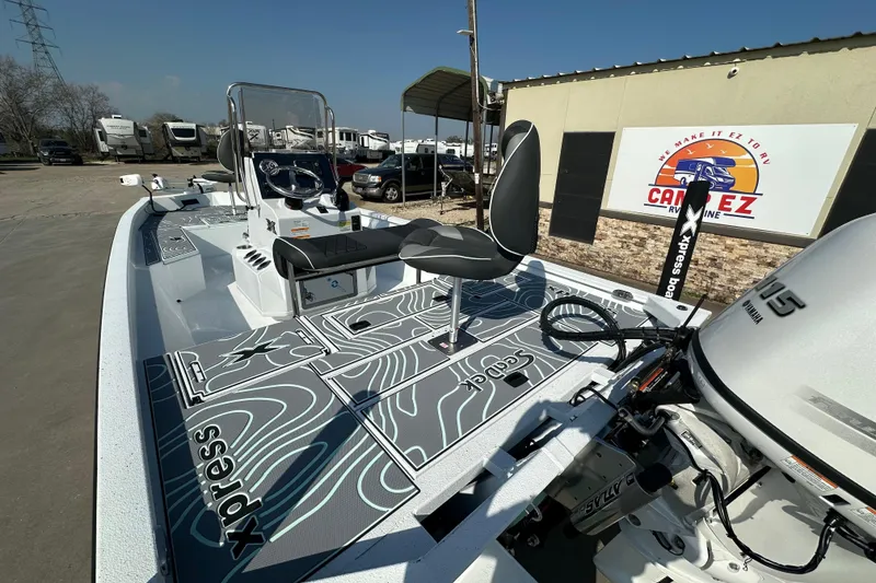 Slide: The Image of 2026 Xpress SW20B boat with Yamaha engine, parked at dealership, featuring sleek design and modern seating. - 9