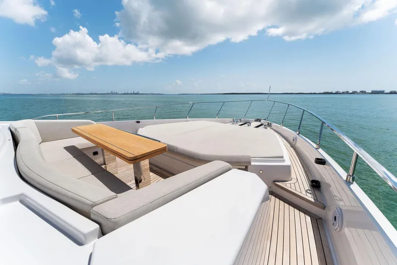 Slide: The Image of Luxurious 2023 Ferretti Yachts 780 cruising on open sea under clear skies. - 12