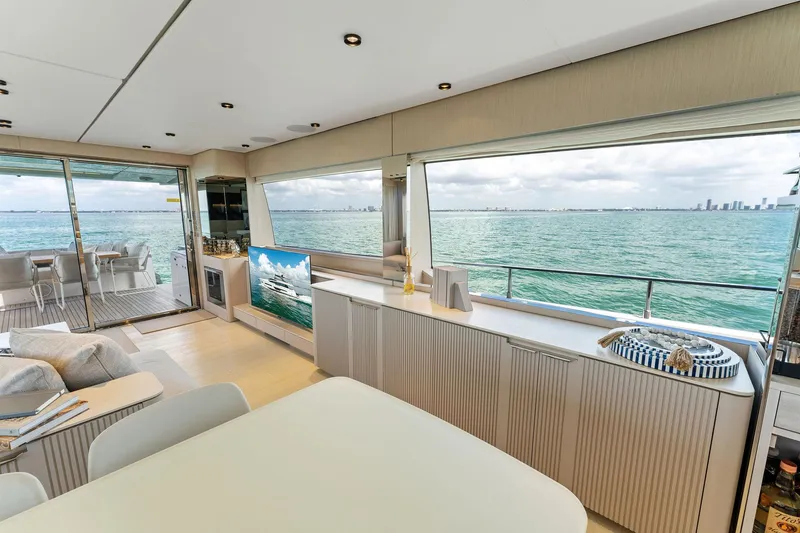 Slide: The Image of Luxurious interior of 2023 Ferretti Yachts 780 with elegant seating and ocean view. - 43