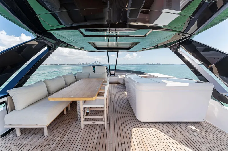 Slide: The Image of Luxurious 2023 Ferretti Yachts 780 deck with ocean view and comfortable seating. - 17