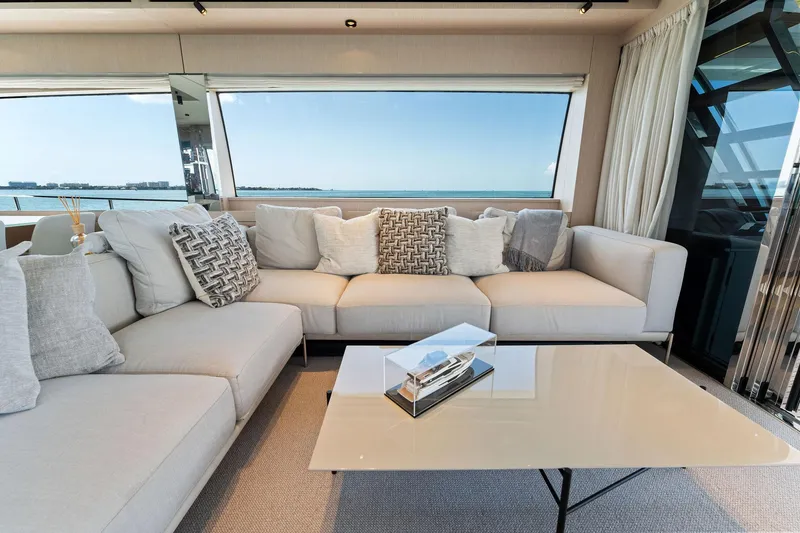 Slide: The Image of View of Ferretti Yachts 780, 2023 model, featuring sleek overhead design against blue sky. - 28