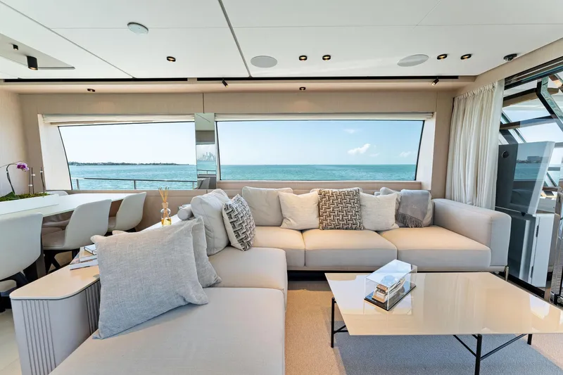 Slide: The Image of Luxurious Ferretti Yachts 780 interior, 2023 model, featuring elegant seating and a yacht model display. - 33
