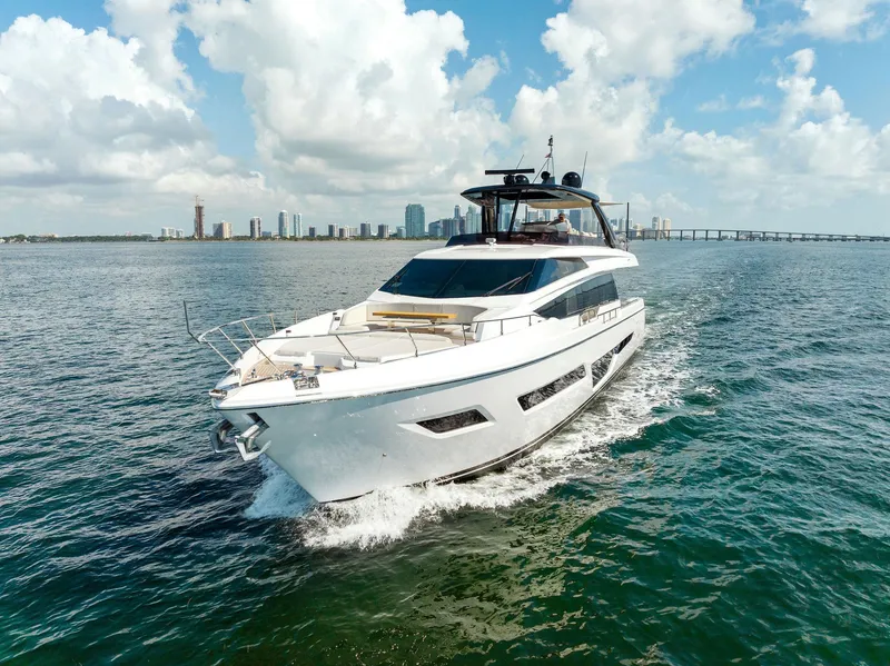 Slide: The Image of 2023 Ferretti Yachts 780 cruising on open water under a clear blue sky. - 5