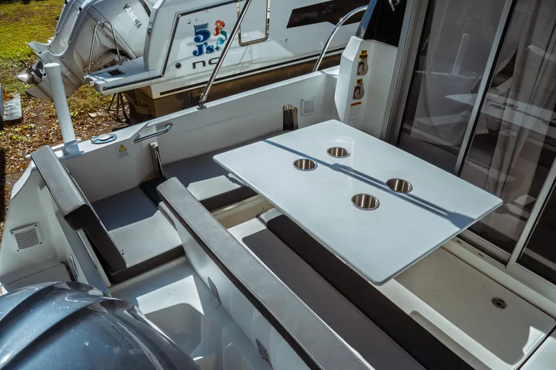 Slide: The Image of 2024 Jeanneau NC 795 Series 2 boat interior with seating and table. - 14