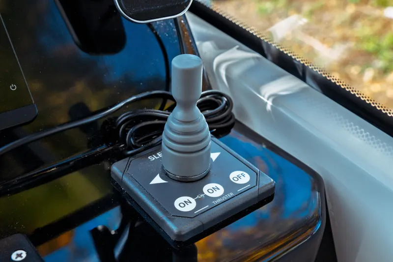 Slide: The Image of Joystick control panel on 2024 Jeanneau NC 795 Series 2 boat dashboard. - 38