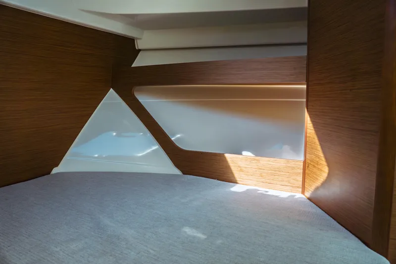 Slide: The Image of 2024 Jeanneau NC 795 Series 2 interior cabin with wood paneling and modern design. - 42