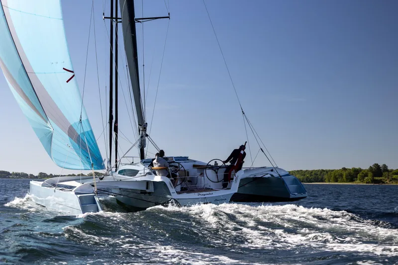 Slide: The Image of Dragonfly 36 sailboat on the water, 2027 model. - 2