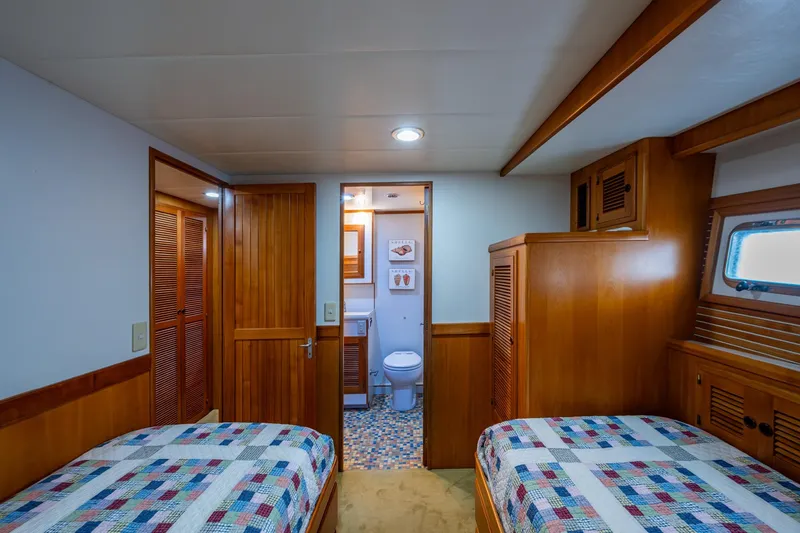 Slide: The Image of Starboard guest cabin looking forward to private head entrance and hanging locker - 26