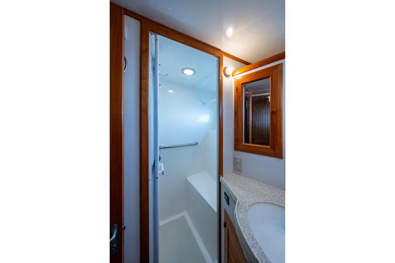 Slide: The Image of Bathroom interior of 2006 Krogen 58 yacht with shower and wooden accents. - 39