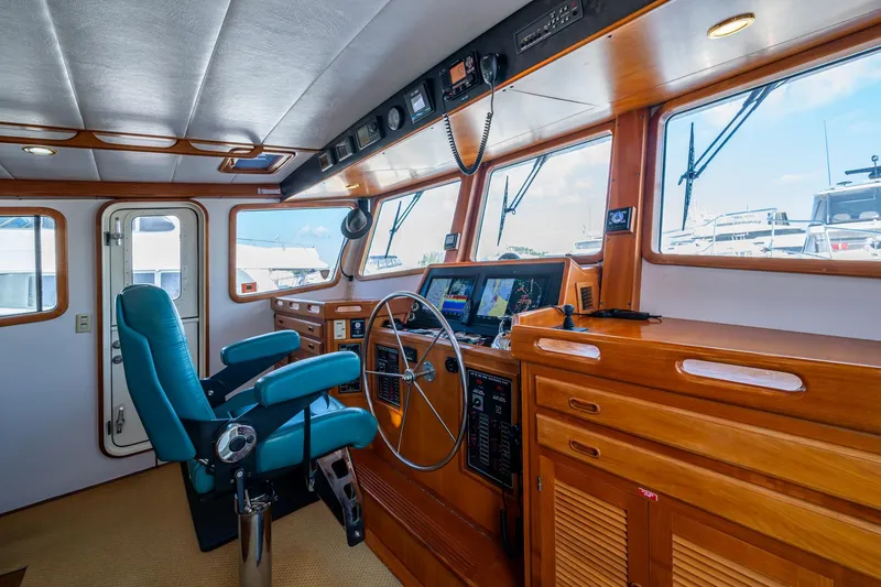 Slide: The Image of Pilothouse of 2006 Krogen 58 yacht with navigation equipment and captain's chair. - 44