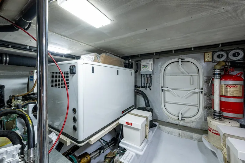 Slide: The Image of Engine room of 2006 Krogen 58 yacht with generator and safety equipment. - 61