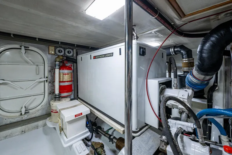 Slide: The Image of Engine room of 2006 Krogen 58 yacht with Northern Lights generator and safety equipment. - 62