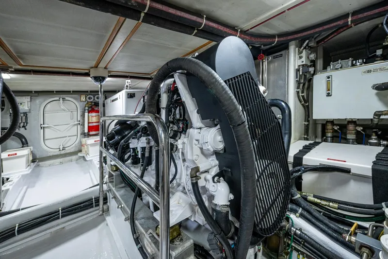 Slide: The Image of Engine room of 2006 Krogen 58 yacht, featuring mechanical equipment and piping. - 63