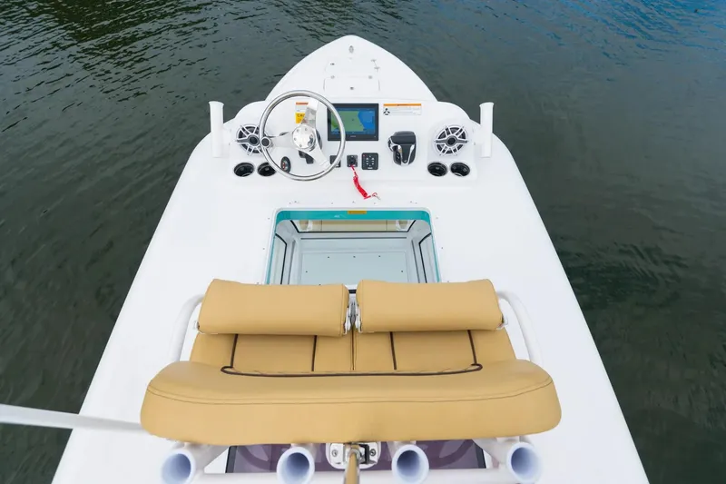 Slide: The Image of Manufacturer Provided Image: 2025 Sportsman Masters 267OE Bay Boat helm with tan seating and modern controls. - 3