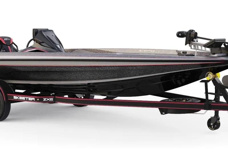 The Image of 2026 Skeeter ZXE21 boat on trailer, sleek black design with red accents. - 1