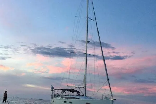 The Image of Sailing yacht Jeanneau 54 (2016) on open sea under clear blue sky. - 0
