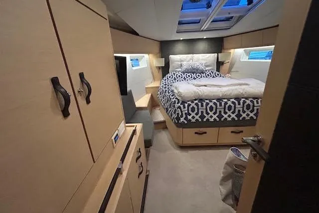 Slide: The Image of Luxurious cabin interior of a 2016 Jeanneau 54 yacht with modern furnishings. - 17