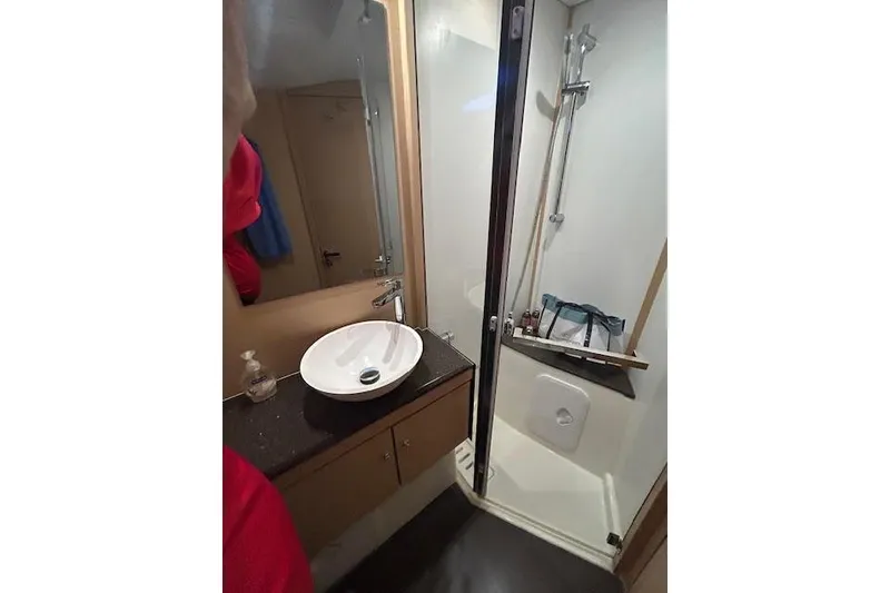 Slide: The Image of Bathroom interior of 2016 Jeanneau 54 yacht with sink and shower. - 28