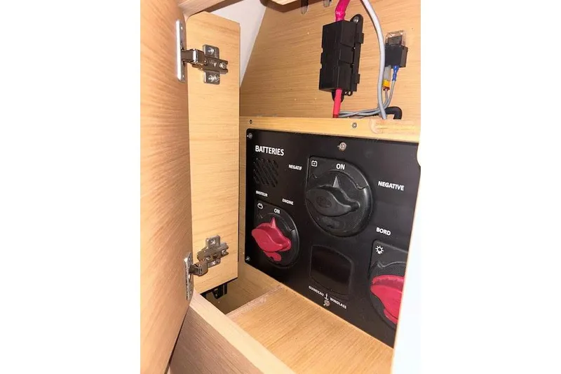 Slide: The Image of Battery control panel inside Jeanneau 54 yacht, 2016 model, with switches and wiring. - 47