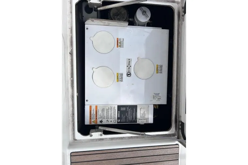 Slide: The Image of Engine compartment of a 2016 Jeanneau 54 sailboat, showing mechanical components. - 50