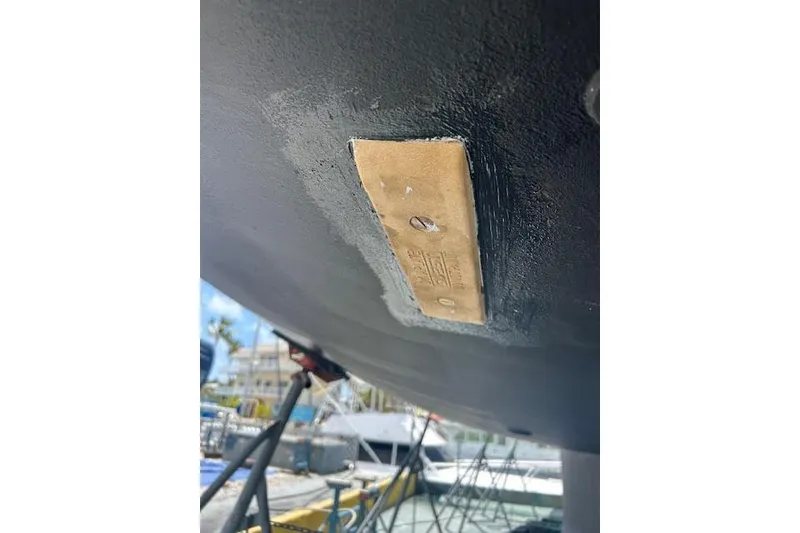 Slide: The Image of Bottom view of a 2016 Jeanneau 54 sailboat hull with a metal plate. - 62