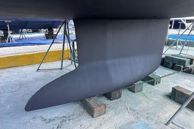 Slide: The Image of Keel of a 2016 Jeanneau 54 sailboat on dry dock. - 64